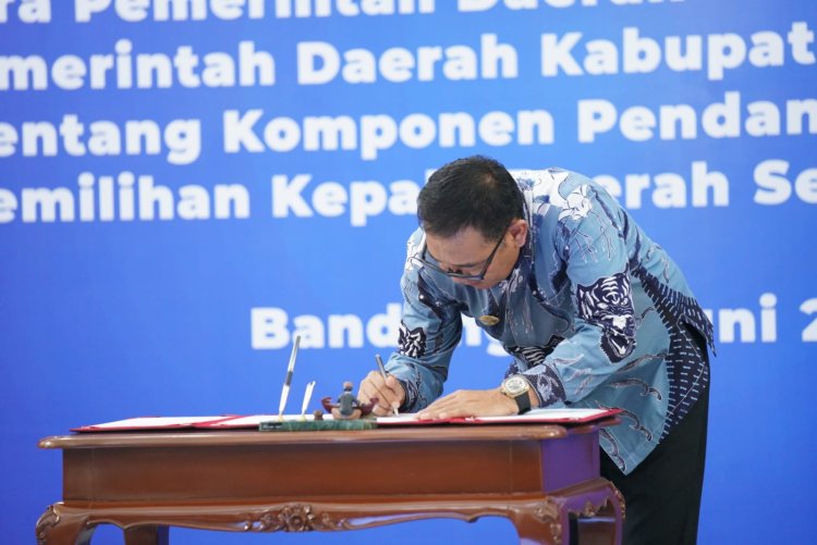 Iwan Setiawan Tandatangani Kesepakatan Komponen Pendanaan Pilkada Serentak 2024